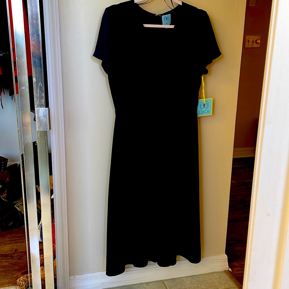 New CeCe Navy empire waist dress. Hand wash no need to go to the dry cleaners!